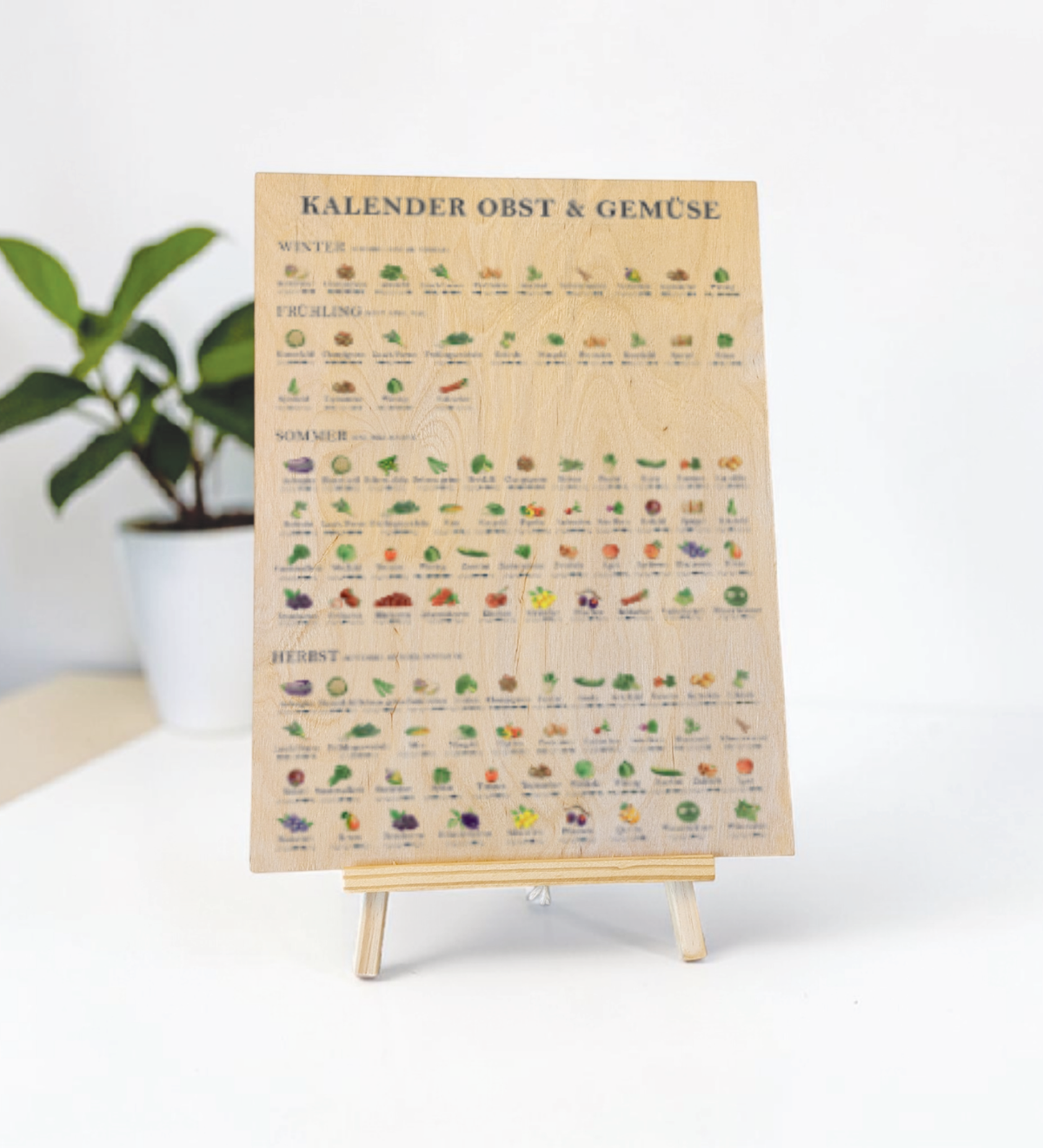 Saisonkalender für Obst und Gemüse als Küchenbild – liebevoll illustriert mit Jahreszeitenübersicht, nachhaltigem Design und UV-Druck auf 9mm Birkensperrholz, das Bild ist ideal als Küchendeko oder Geschenk für umweltbewusste Haushalte.
